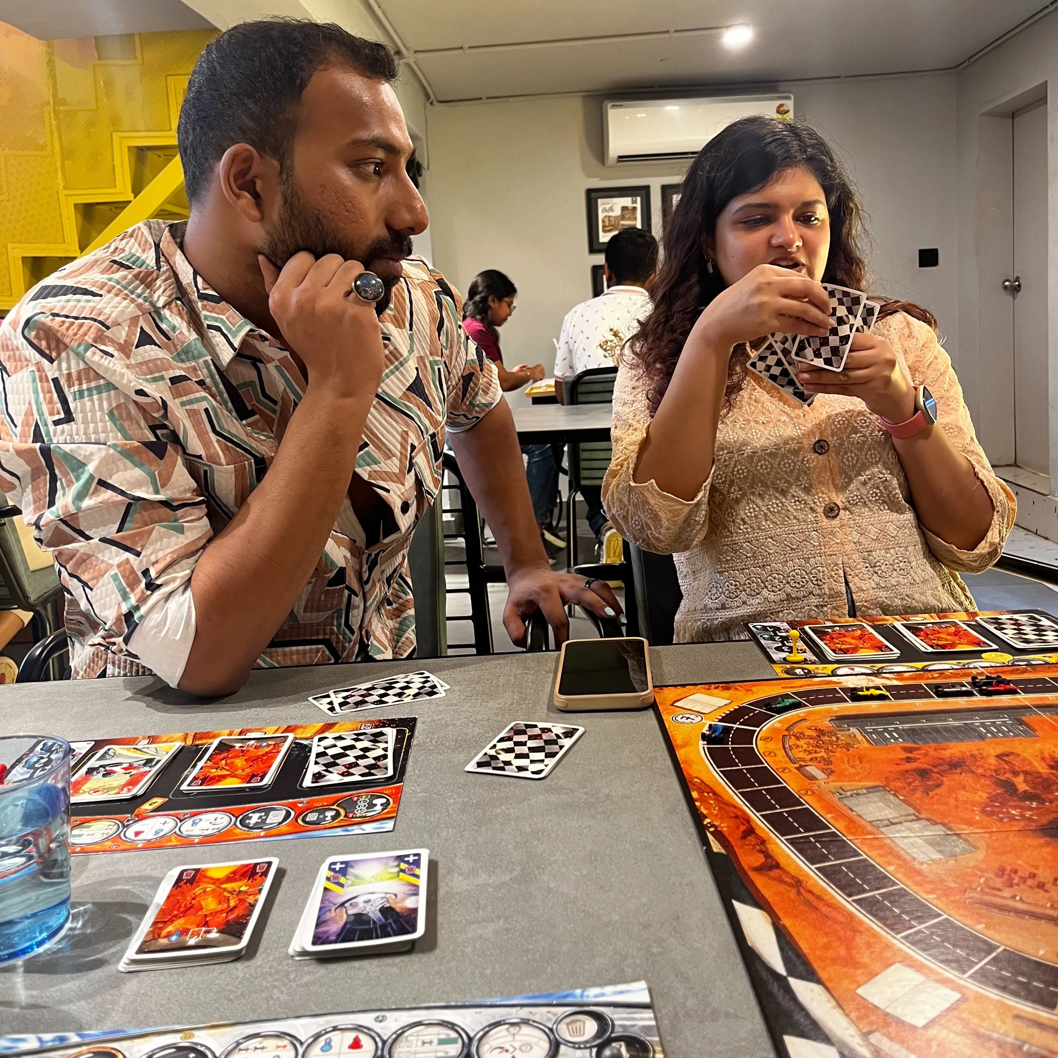 Players gathered around a board game